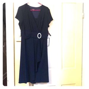 Navy knee length dress with rhinestone accent